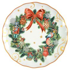 a christmas wreath plate with a red bow and nutcrackers on the front