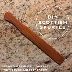 a wooden toothbrush sitting on top of a granite counter next to a white circle with the words diy scottish sprite