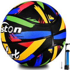 a black and blue basketball next to a ball with colorful designs on it, including a marker