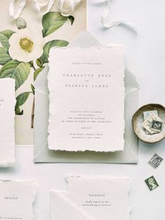 the wedding stationery is laid out and ready to be used as an additional piece of paper