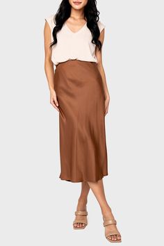 Smooth satin fabric adds to the elegance of this beautifully draped Sanctuary midi skirt designed for a perfect fit with an elastic waist. 71% Viscose | 29% Polyester Machine Wash Cold Inside Out, Line Dry Length 39" (Size Small) Jing is 5'3 and wearing size XS Sanctuary Size Guide