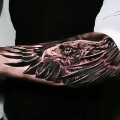 an eagle tattoo is shown on the arm