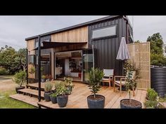 a wooden deck with potted plants on it