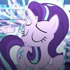 a purple and white pony with its eyes closed