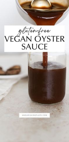 the ingredients for vegan oyster sauce in a glass jar with spoons on top