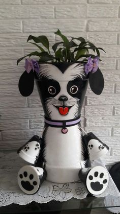 a ceramic dog planter sitting on top of a table