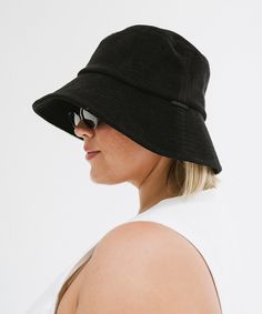 This bucket hat transitions seamlessly from the water to the street. Pair it with your favorite swimwear, a flowy sundress, or casual shorts + a tee for an effortlessly chic summer look! The oversized brim provides ample shade, protecting your face from the sun's harsh rays, while the relaxed fit ensures it stays comfortably in place without feeling too tight. Casual Sun Hat For Beach Season, Casual Bucket Hat For Vacation, Casual Sun Hat With Short Brim For Day Out, Casual Black Bucket Hat With Upf 50+, Casual Wide Brim Sun Hat, Casual Brimmed Bucket Hat For Beach Season, Wide Brim Casual Bucket Hat For Beach Season, Casual Lightweight Wide Brim Bucket Hat, Casual Wide Brim Bucket Hat Lightweight