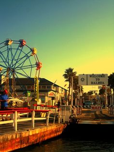 a ferris wheel sitting on top of a pier