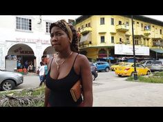 a woman standing in the middle of a street