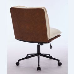 a brown and white office chair with casteors on wheels, viewed from the front