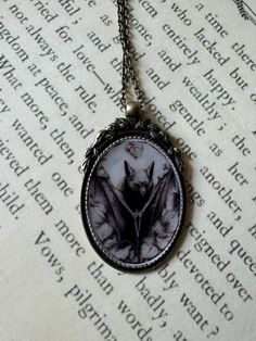 Handmade bronze necklace with bat print in big pedant, coated with epoxy resin. Pedant size is 1.38 x 2.2 inches, length  necklace is 24 inches. Vintage Nickel Free Necklaces For Halloween, Goth Resin Jewelry, Gothic Necklace With Large Pendant, Vintage Nickel-free Necklace For Halloween, Romantic Goth Necklace, Red Bat Necklace, Spooky Birthday, Gothic Bat Necklace, Bat Print