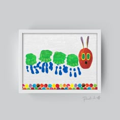 the very hungry caterpillar art print is displayed in a white frame on a gray wall