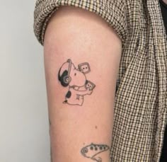 a person with a tattoo on their arm