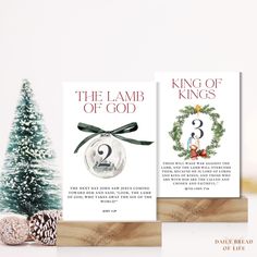 two christmas cards with the number three on them next to a pine cone and evergreen tree