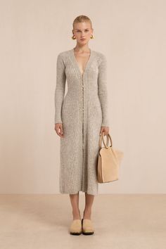 A long-sleeve ribbed knit dress with a v neckline and hook and eye closures down the front. — Midi length — Ribbed knit — Hook and eye front closure — Long sleeve Fall Modest Dresses, Knit Dress And Boots, Casual Long Sleeve Maxi Dress, Cozy Winter Dresses, Long White Knit Dress, Casual Sweater Dress, Chic Wardrobe, Long Ribbed Dress Outfit, Rib Knit Dress