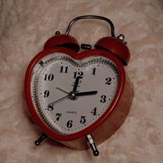 an alarm clock in the shape of a heart