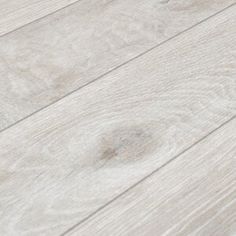 a close up view of the white wood flooring