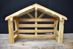 a small wooden structure sitting on top of a table