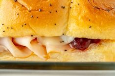 These Cranberry Turkey Sliders channel all of the fall vibes with warm bread, melty cheese, and bright cranberry sauce!