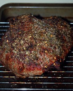 a piece of meat sitting on top of a grill