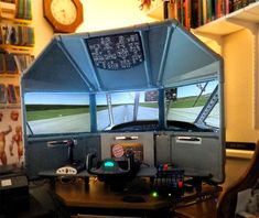 a desk with a computer on top of it