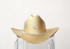 YEEHAW! Our most popular blinged out Cowboy hats are here in perfect metallics! Want it without crystal star? Write "NO STAR" in the notes section! Super limited quantities! Size chart S/M- Has elastic insert making it fit more snug- 24" around but fits 22-26" L/XL-Has elastic insert making it fit more snug- 28" around but fits 26-30" This item is made to order in our Costa Mesa Studio! Gold Country Style Hat For Rodeo, Adjustable Gold Hats For Rodeo, Gold Cowboy Hat, Luxury Gold Western Hat, Luxury Rigid Cowboy Hat For Western-themed Events, Taylor Swift Tour Outfits, Crystal Stars, Cowboy Hats, Full Length