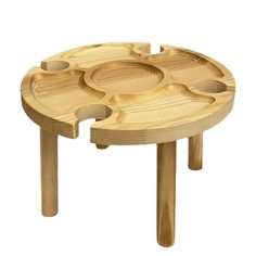 a small wooden table with four compartments on the bottom and one section open to show food