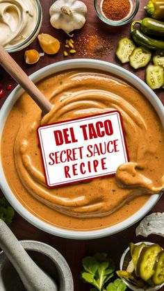 a bowl of soup with a sign that says del taco secret sauce recipe on it