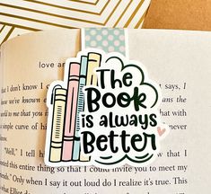 the book is always better sticker sits on top of an open book with text