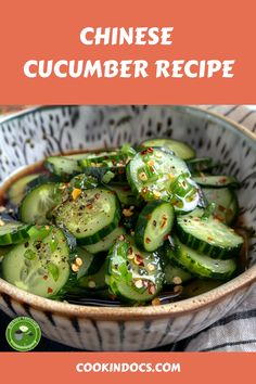 a bowl filled with cucumber slices covered in sesame seeds and topped with seasoning