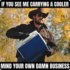 a man wearing a cowboy hat and holding a blue box with the words if you see me carrying a cooler, mind your own damn business