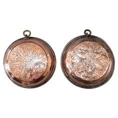 pair of antique copper - plated earrings with floral design, circa 1920's