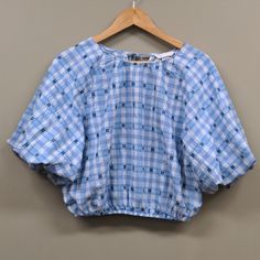 Nwt H&M Bubble Sleeve Blue And White Plaid Elastic Hem Top Small Blouse In Woven Fabric. Features A Round Neckline And An Opening With Narrow Ties Behind The Neck. Voluminous Puff Sleeves In A Raglan Cut That Finish Just Above The Elbows. Covered Elastication At The Cuffs And Hem. 20% Recycled Cotton Size Small Flat Measurements Armpit To Armpit 21" Shoulder To Hem 19" Nwt Blue Relaxed Fit Crop Top For Spring, Relaxed Fit Blue Crop Top For Spring, H&m Light Blue Cotton Top, H&m Blue Tops For Summer, H&m Blue Summer Tops, Puffy Sleeves Shirt, Bubble Sleeve, Small Flat, Hem Top