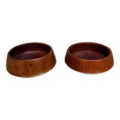 two wooden bowls sitting on top of each other