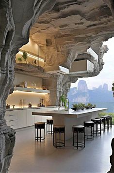 an open kitchen and dining area in a cave