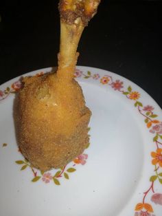 a piece of breaded food on a plate