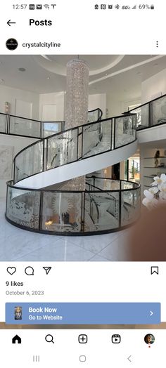 the inside of a house with stairs and chandelier on display in front of it