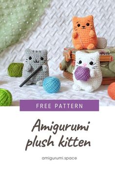 an amigurmi plush kitten is sitting on the bed next to balls of yarn