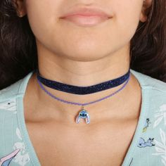 Step into the magical world of Disney with this enchanting Lilo & Stitch Necklace Trio, perfect for young fans and collectors alike. This set includes three uniquely designed necklaces:

- One stretch choker
- One glitter fabric choker necklace
- One chain necklace featuring a delightful Stitch pendant

Each necklace measures 12 inches with a 3-inch extender, ensuring a comfortable fit for most. They are equipped with a lobster claw closure for secure wear and are crafted from faux rhodium-plate Lilo And Stitch Accessories, Stitch Jewelry Disney, Moana Necklace Disney, Stitch Necklace Disney, Disney Christmas Gifts, Disney Jewelry Necklaces, Disney Jewelry Necklace, Stitch Jewelry, Disney Valentines