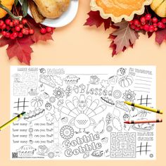 a thanksgiving coloring page with turkeys, leaves and crayons on the table