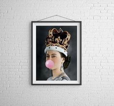 a woman with a bubble gum in her mouth and wearing a crown on top of her head