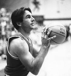 a man holding a basketball in his right hand