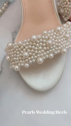 For a bride looking to add a touch of elegance and sophistication to her wedding ensemble, pearls wedding high heels are the perfect choice. These stunning heels are adorned with delicate pearls, creating a timeless and luxurious look Elegant Wedding Sandals, Elegant Open Toe Sandals For Bridesmaids, Formal Pearl Wedding Shoes High Heel, Formal Pearl High Heel Wedding Shoes, Formal High Heel Pearl Wedding Shoes, Elegant Pearl Heels For Evening, Elegant Open Toe Bridal Party Accessories, Summer Wedding Pearl Heels, White Pearl Embellished Wedding Shoes For Bridesmaids