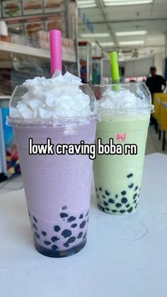 two drinks sitting on top of a table next to each other with the words low carving boba