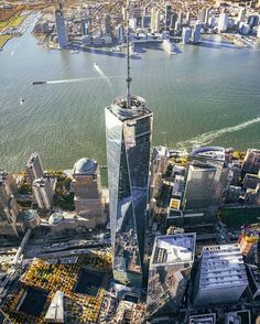 an aerial view of the skyscrapers in new york city, with one world trade center