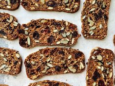 several slices of bread with nuts and raisins on top