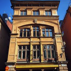 an old building with many windows on the side