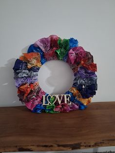 a colorful wreath with the word love on it