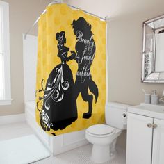 a yellow and black shower curtain with the words beauty is found in nature on it