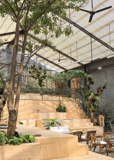 an outdoor seating area with wooden steps and plants